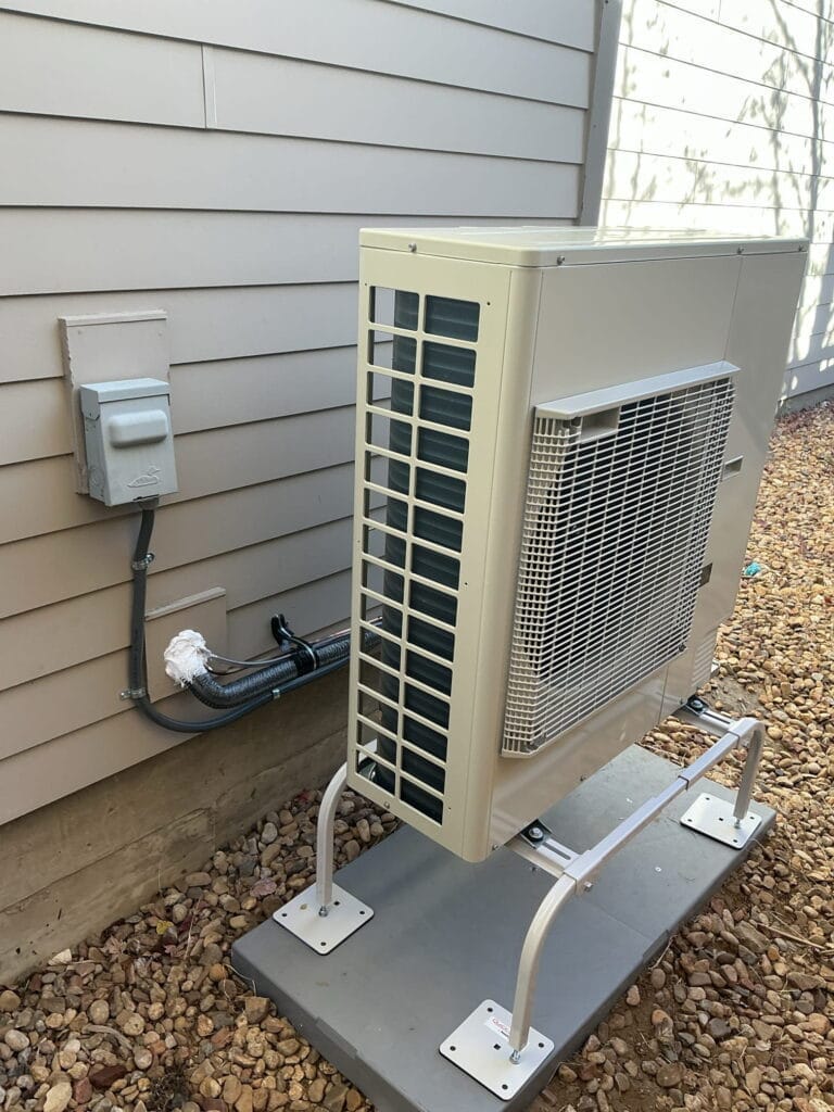 Outdoor heat pump unit serviced by heat pump repair Denver technician