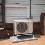 Outdoor ductless heat pump service Denver beside a home in Denver Metro