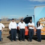 Denver metro HVAC technicians standing beside a Comfort Crew service van, Air Conditioning Maintenance Near Me, air conditioner repair service near me
