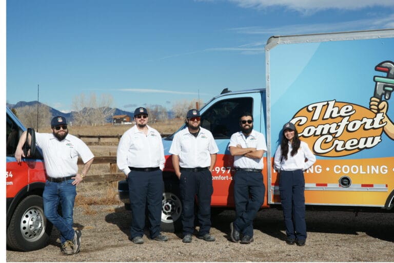 Denver metro HVAC technicians standing beside a Comfort Crew service van